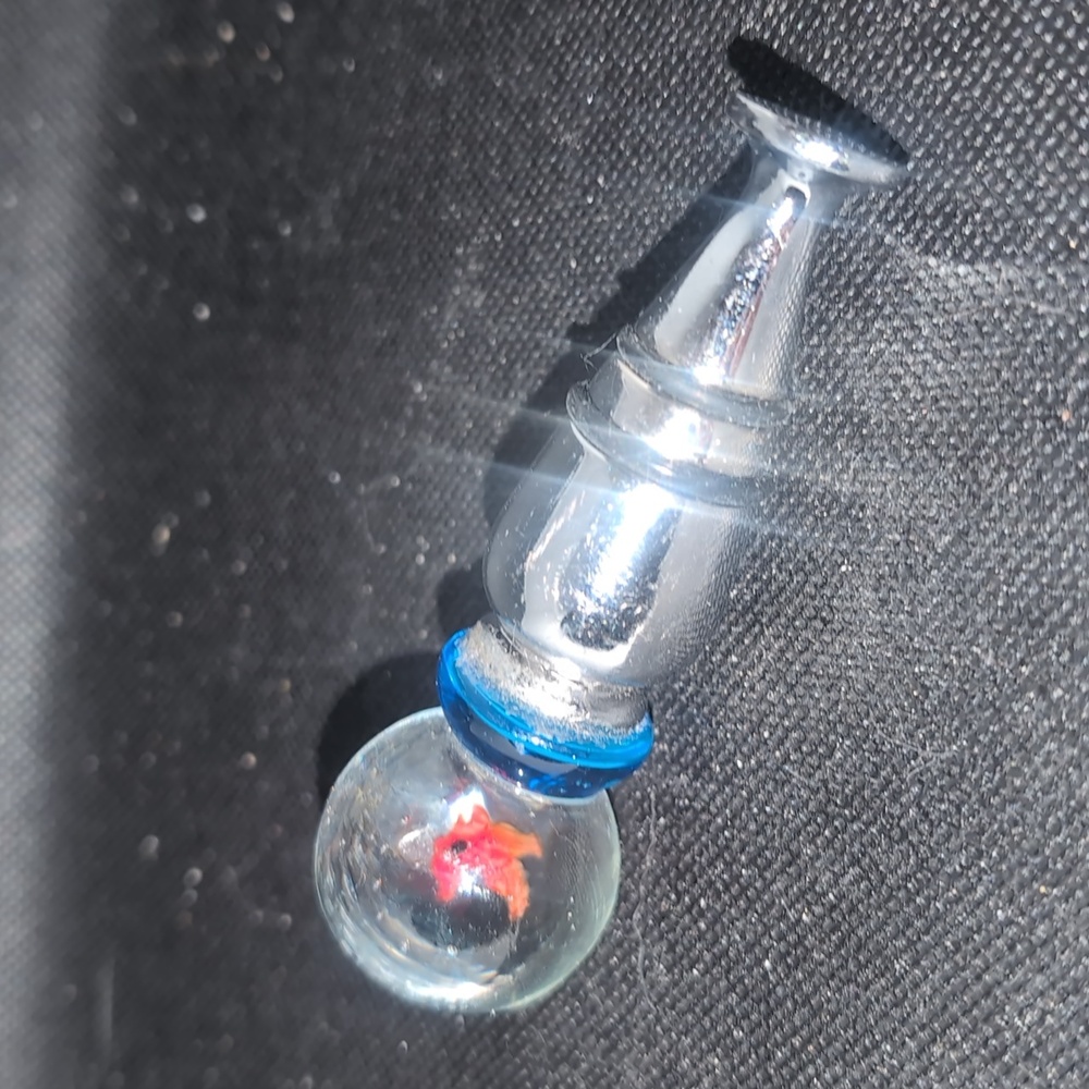 AVAILABLE -House of marbles glass wine stopper with suspended fish. 3.5" Tall